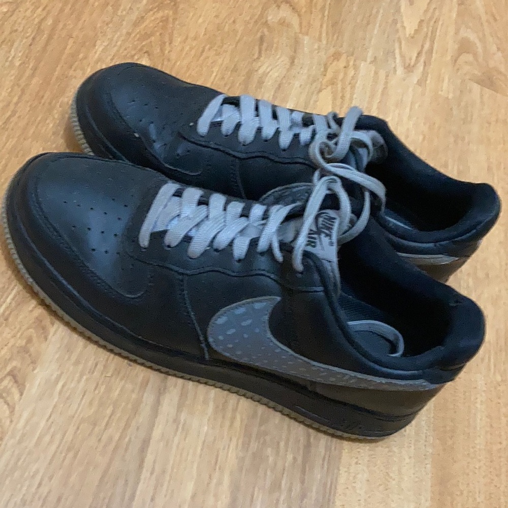 Black and grey Nike Air Force Ones